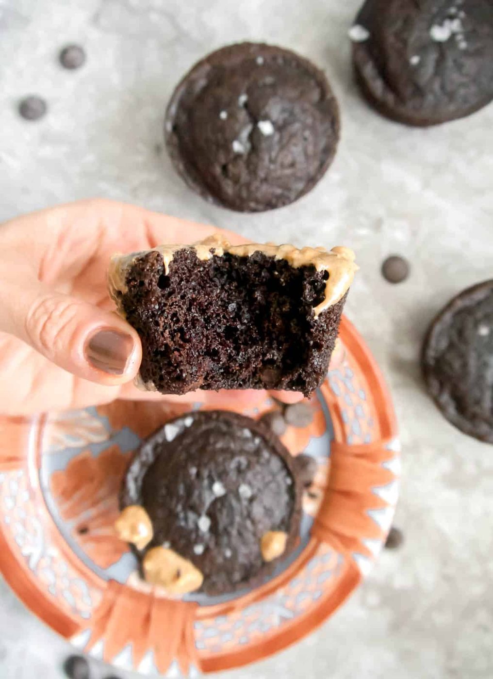 Almond flour chocolate muffin with a bite taken out of it.
