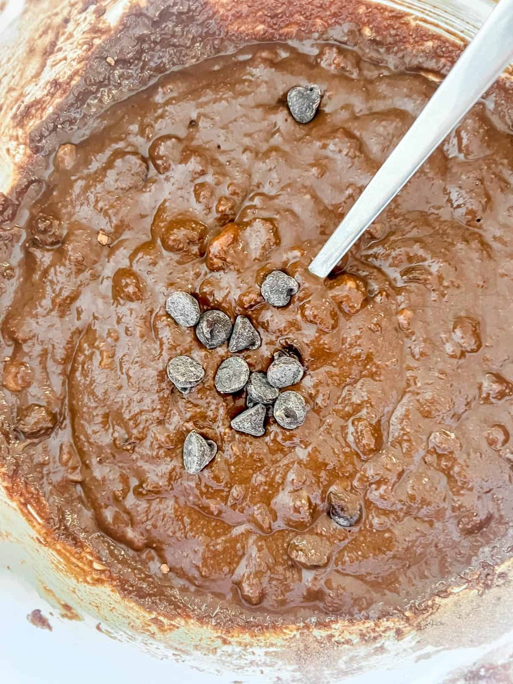 Chocolate chips folded into the chocolate muffin batter.