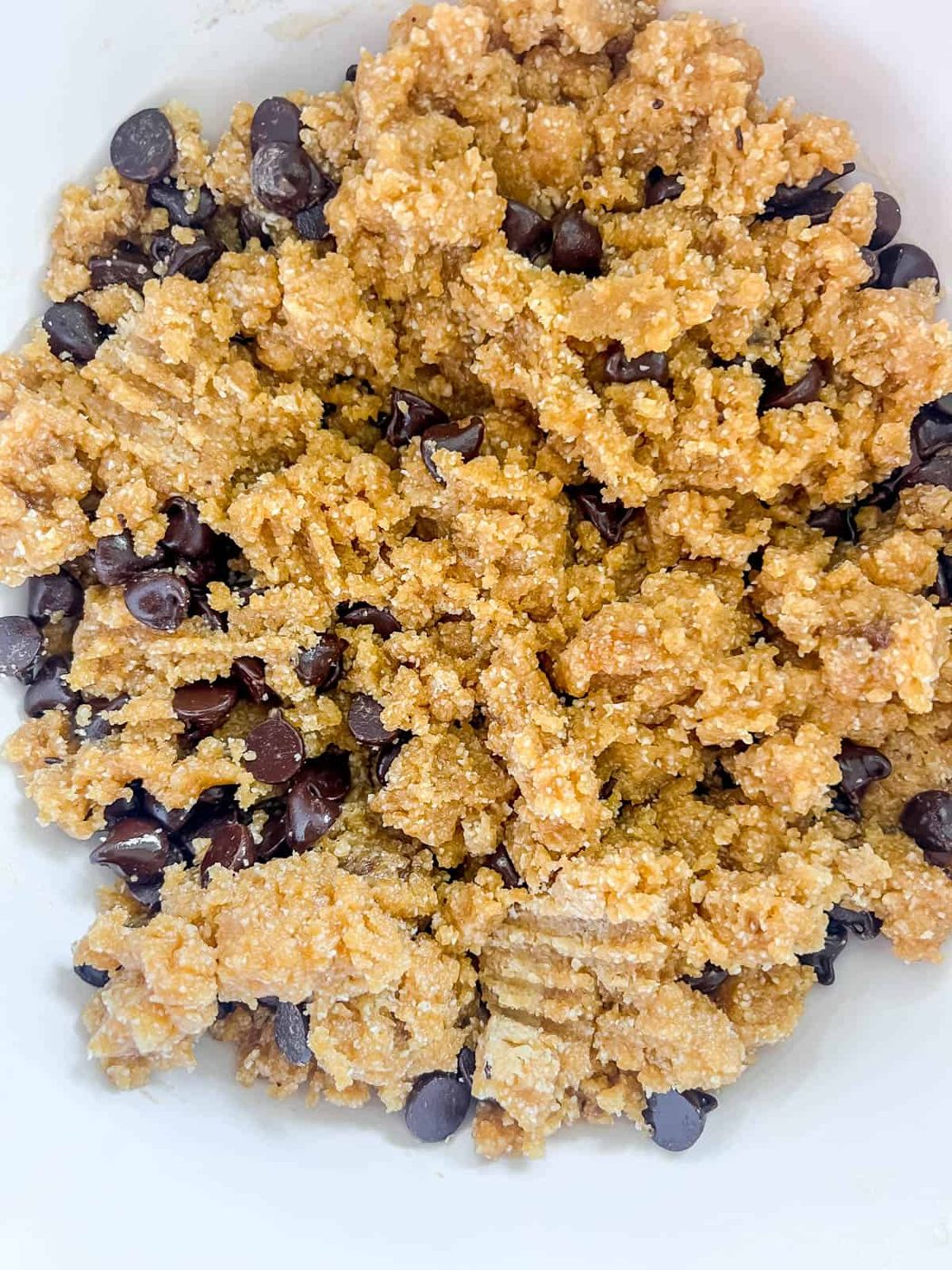 Almond flour cookie bar batter in a bowl.