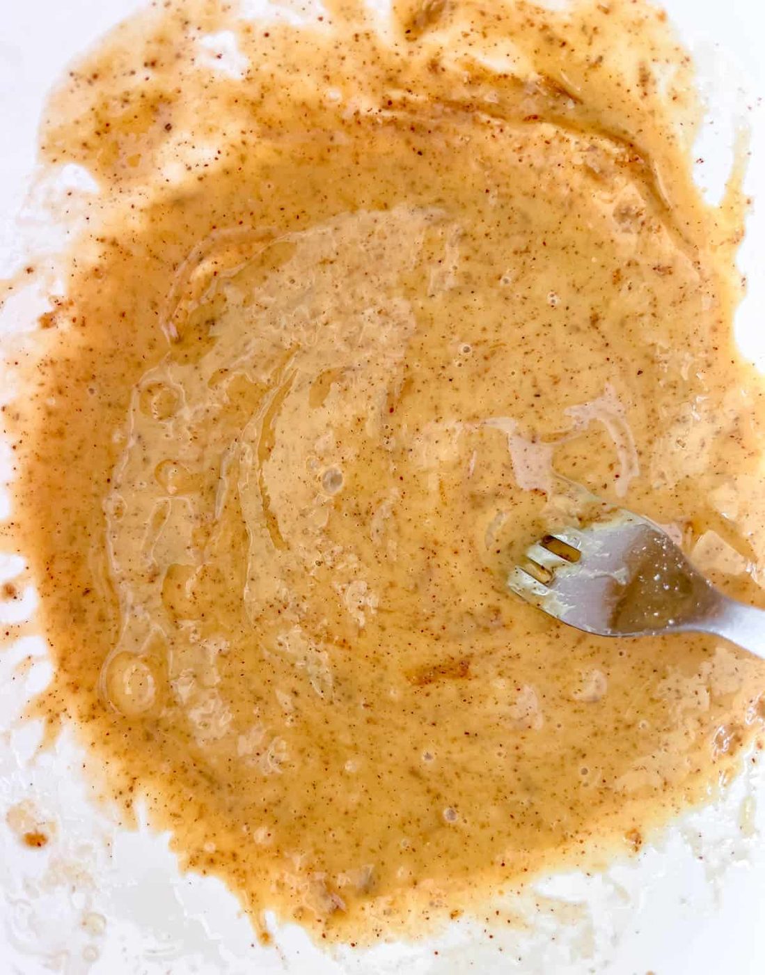 Wet ingredients mixed together in a bowl.