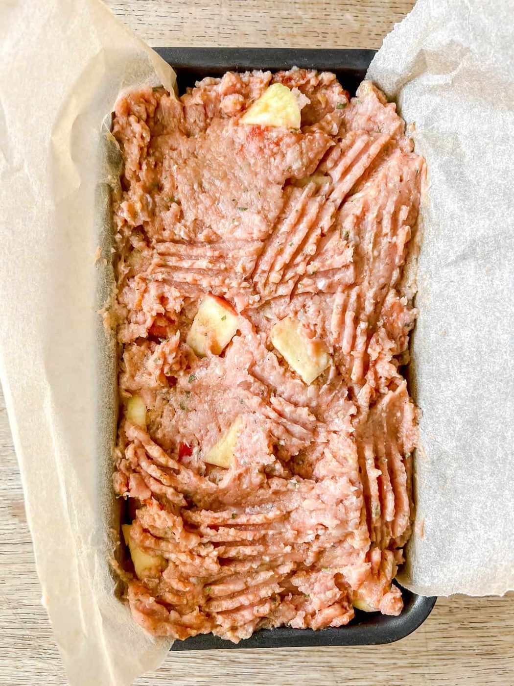 Meatloaf in a tin before baking.