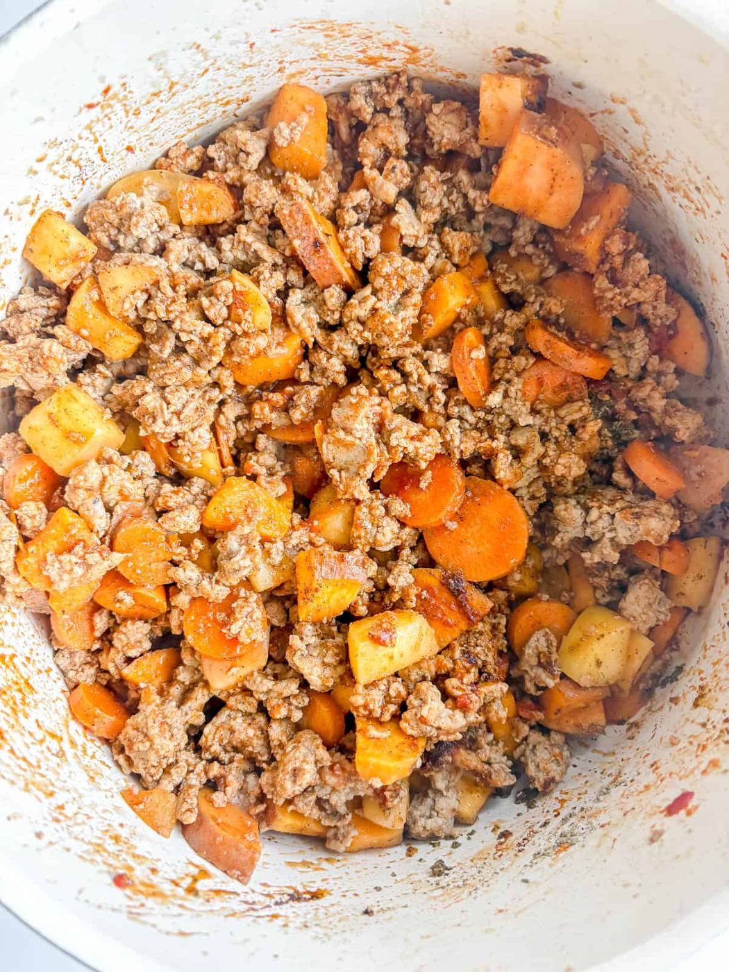 Tomato paste added to the ground turkey.