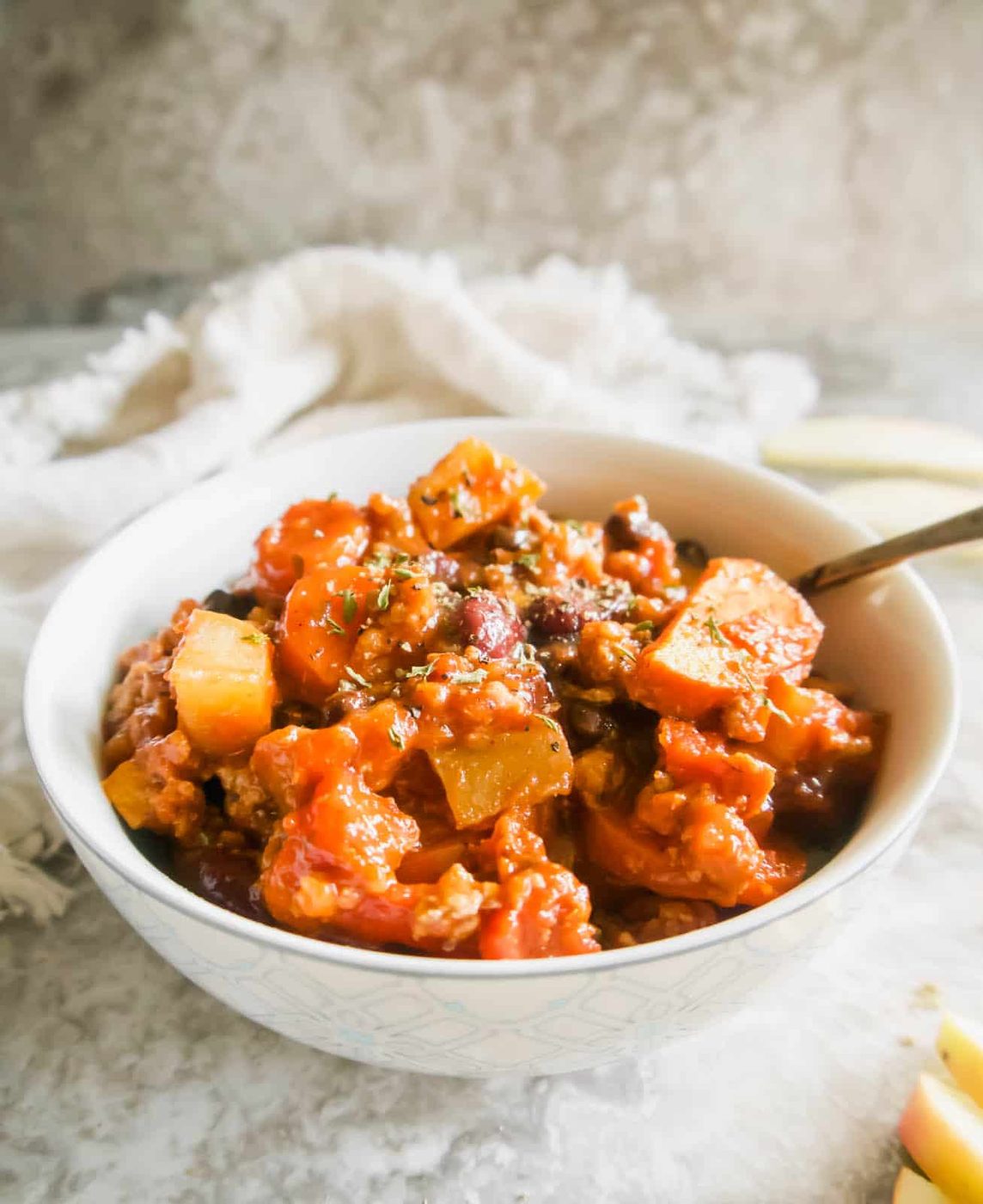 Side angle of turkey apple chili in a bowl.