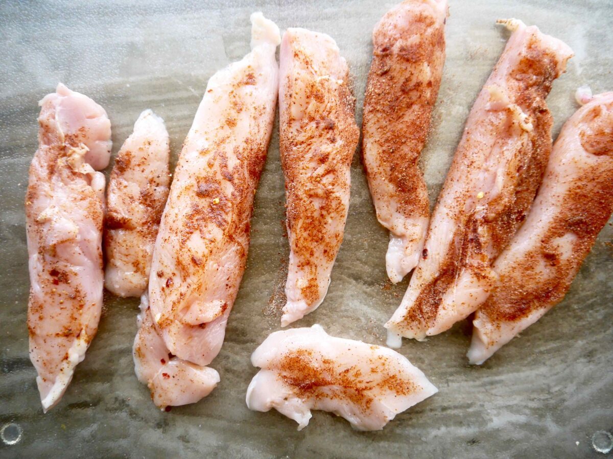 Raw chicken with seasoning.