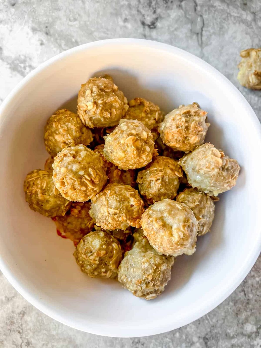 Gluten free turkey meatballs made with oats in a bowl.