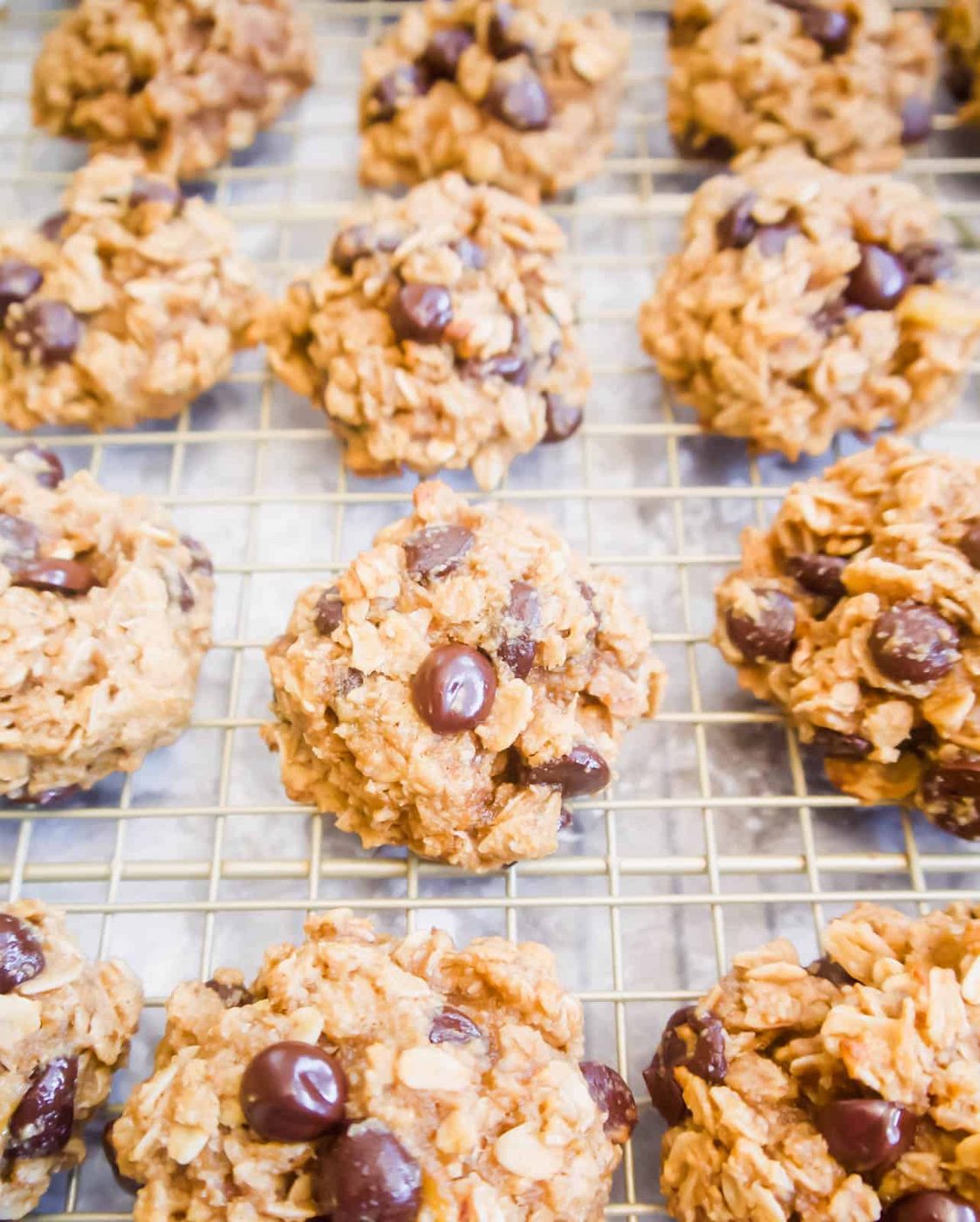 Banana oat chocolate chip cookies on a wire rack.