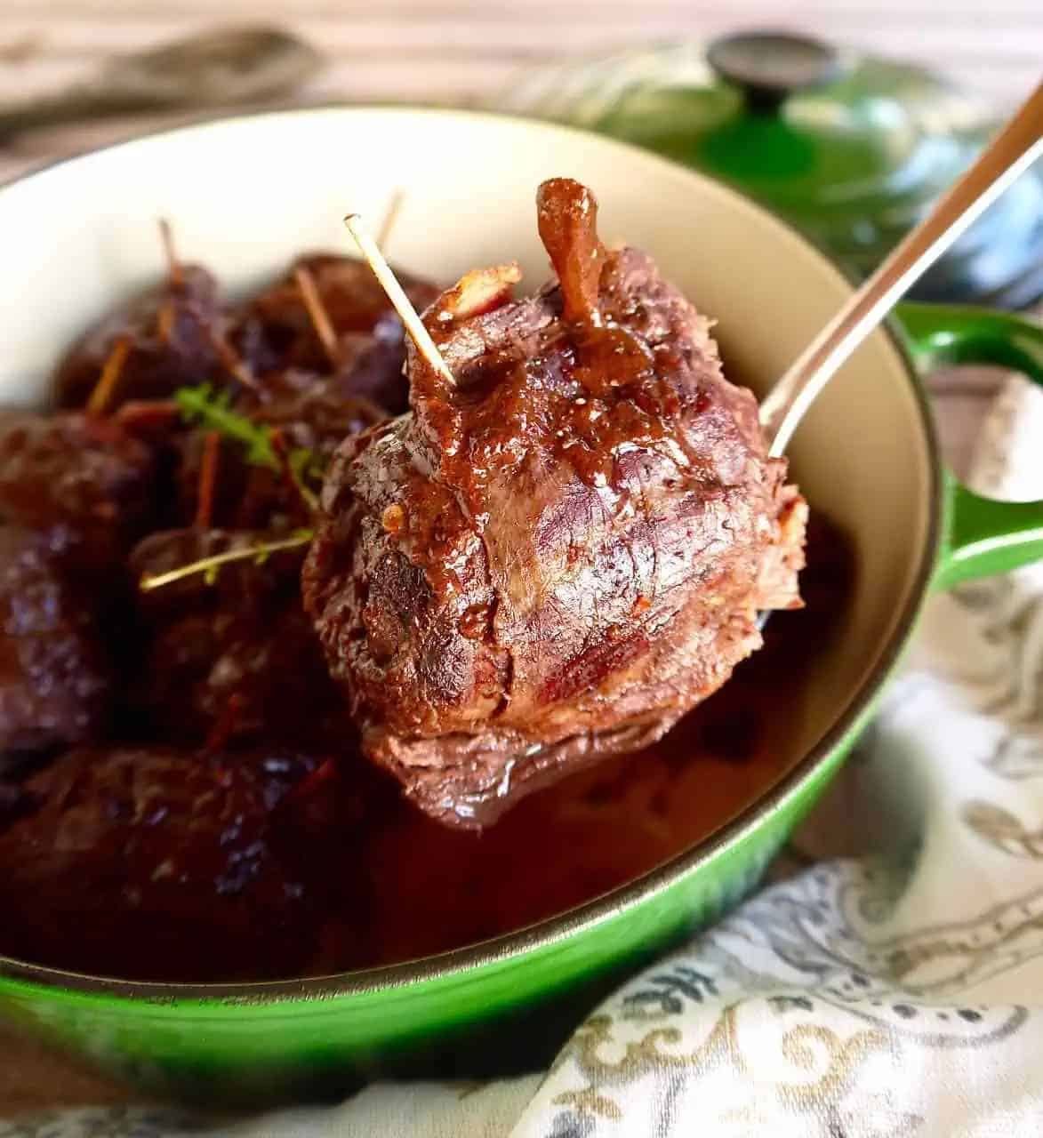 Beef rouladen in a spoon.