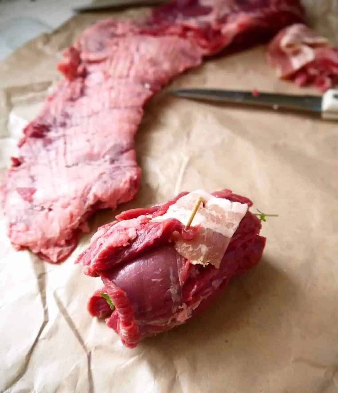 Beef roll ups with bacon before cooking.