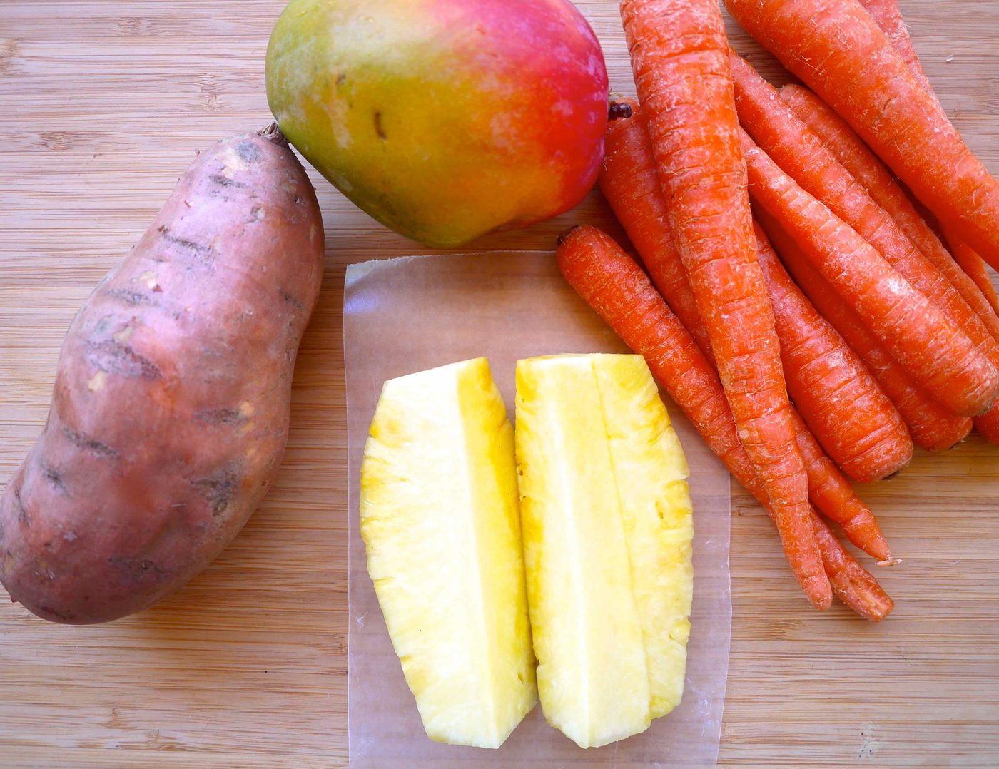 Ingredients needed to make Beta-Carotene Carrot Mango Sweet Potato Juice.