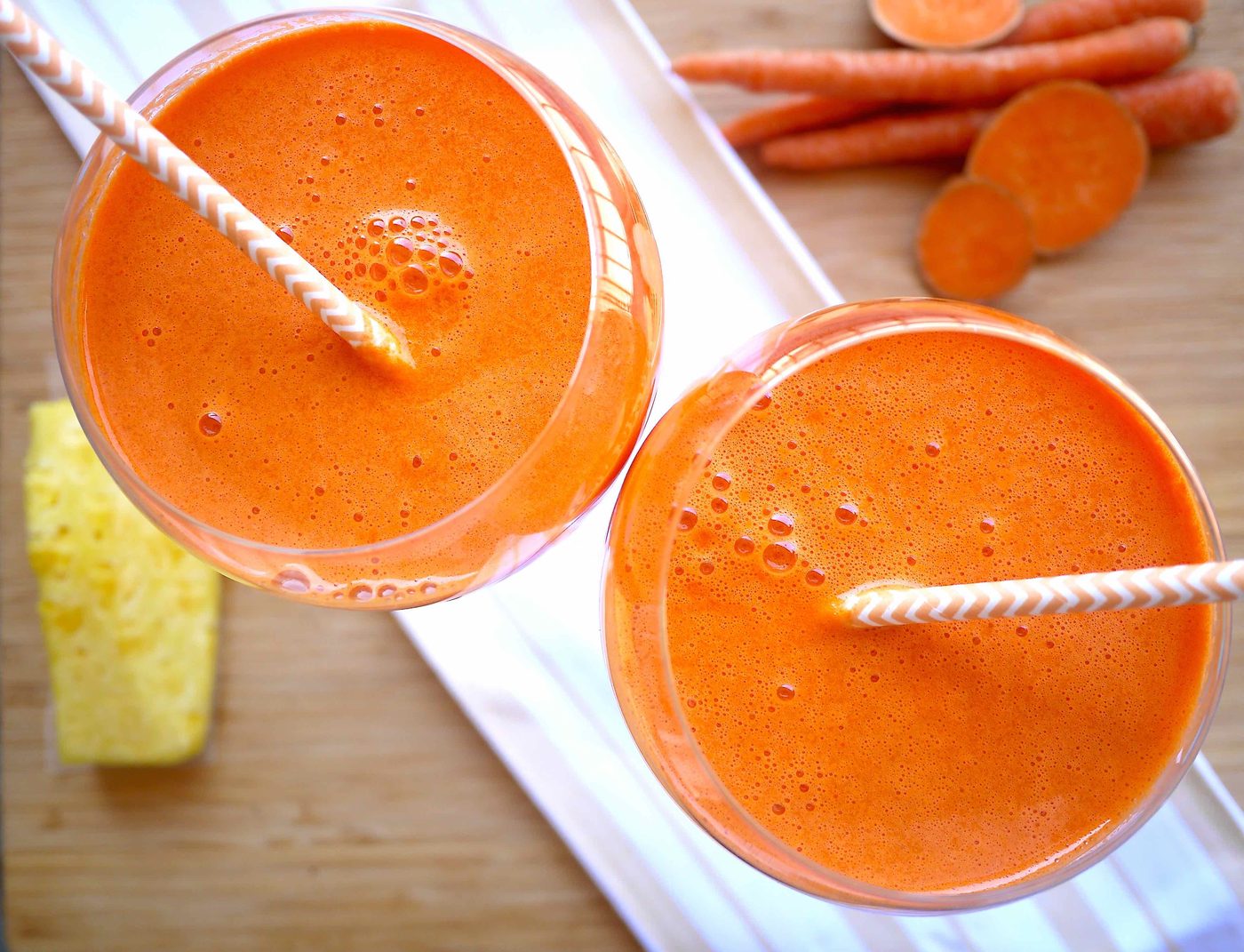 Mango carrot juice in two glasses.