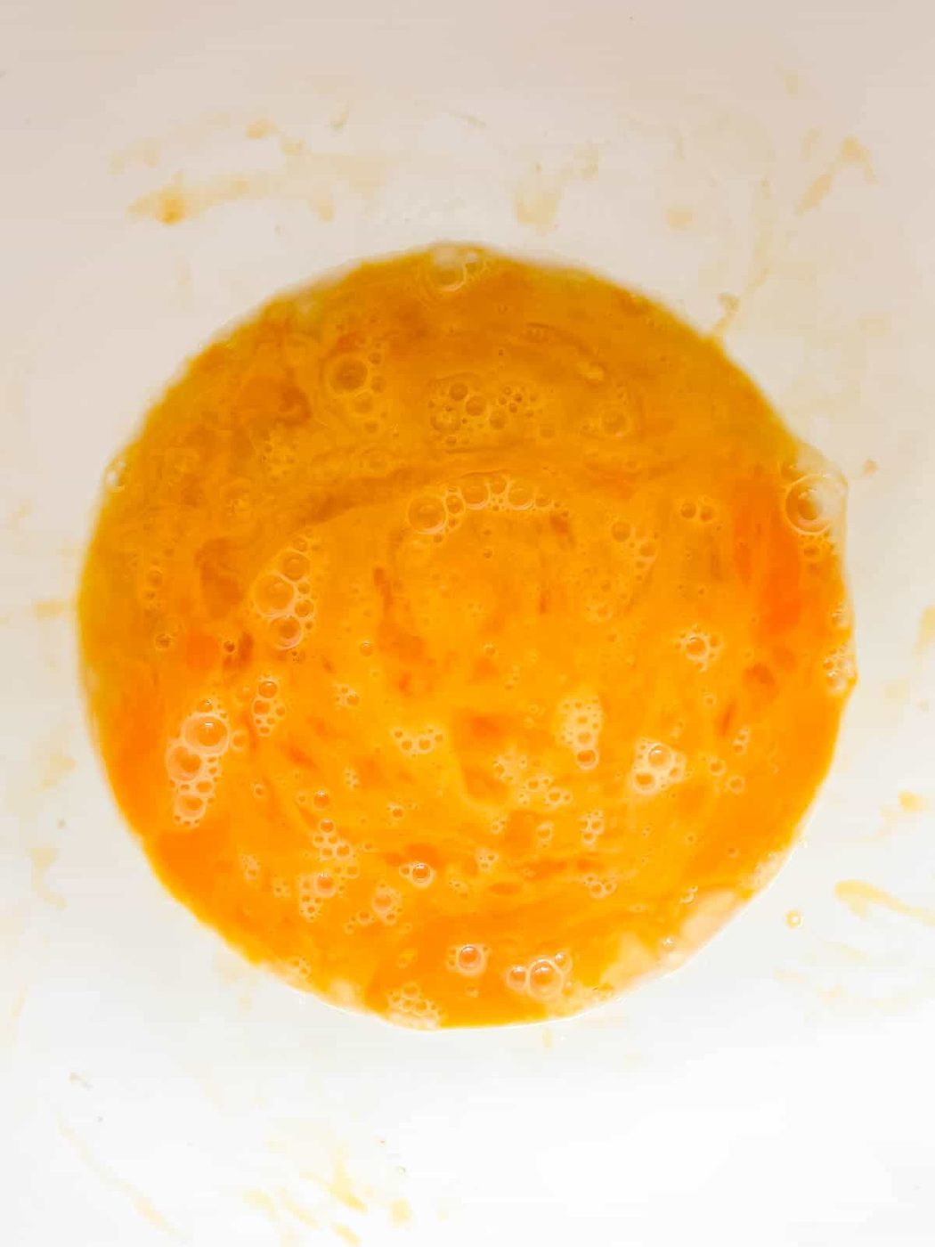 Eggs mixed together in a bowl.