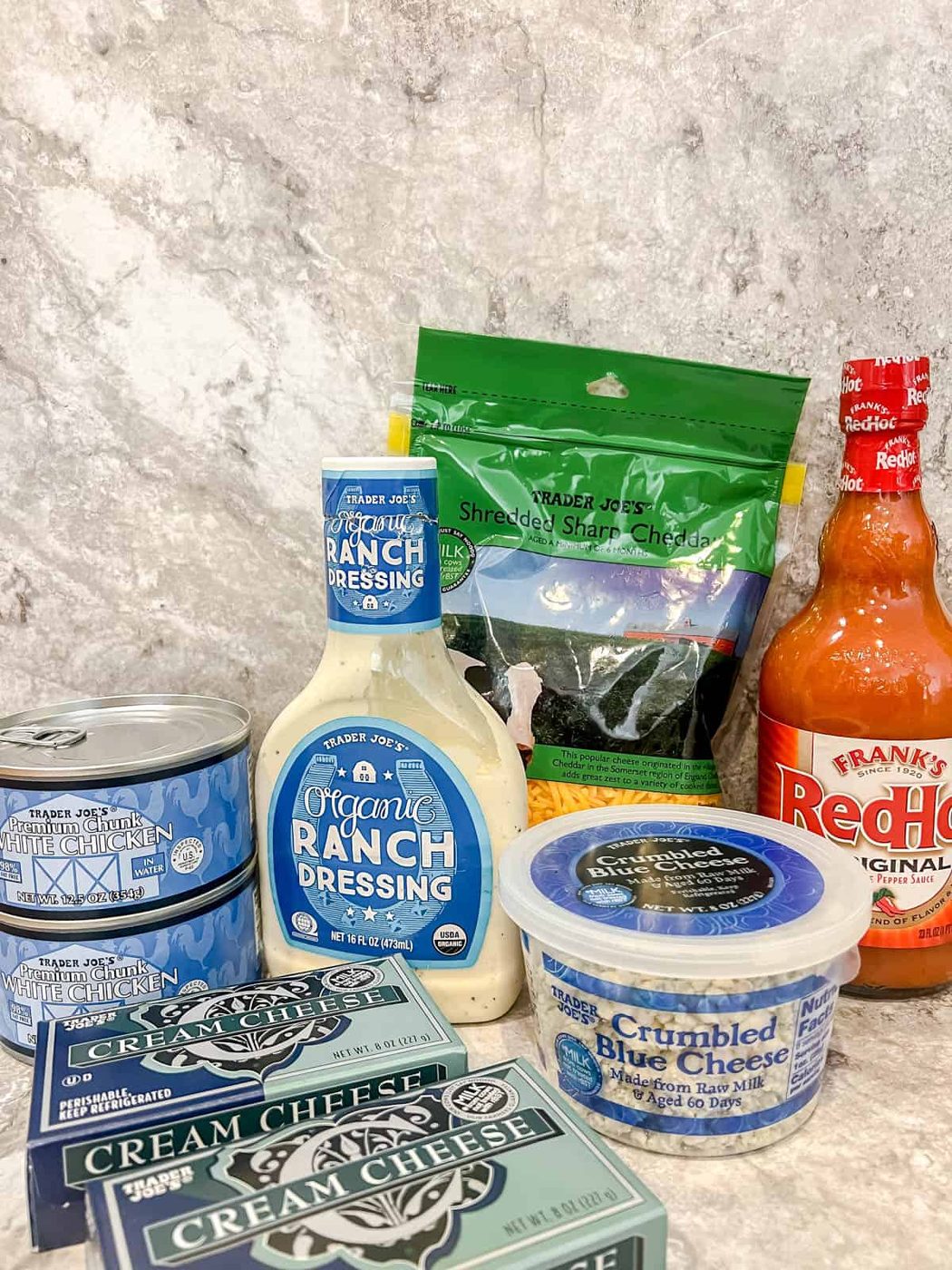 Ingredients needed to make buffalo chicken dip.