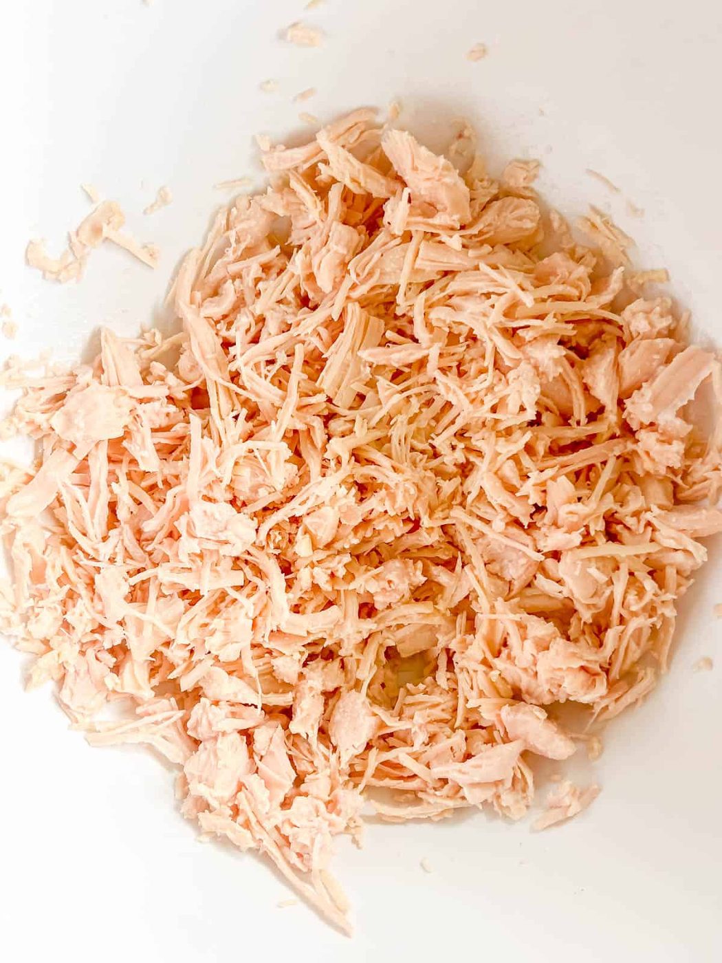 Canned chicken in a bowl.