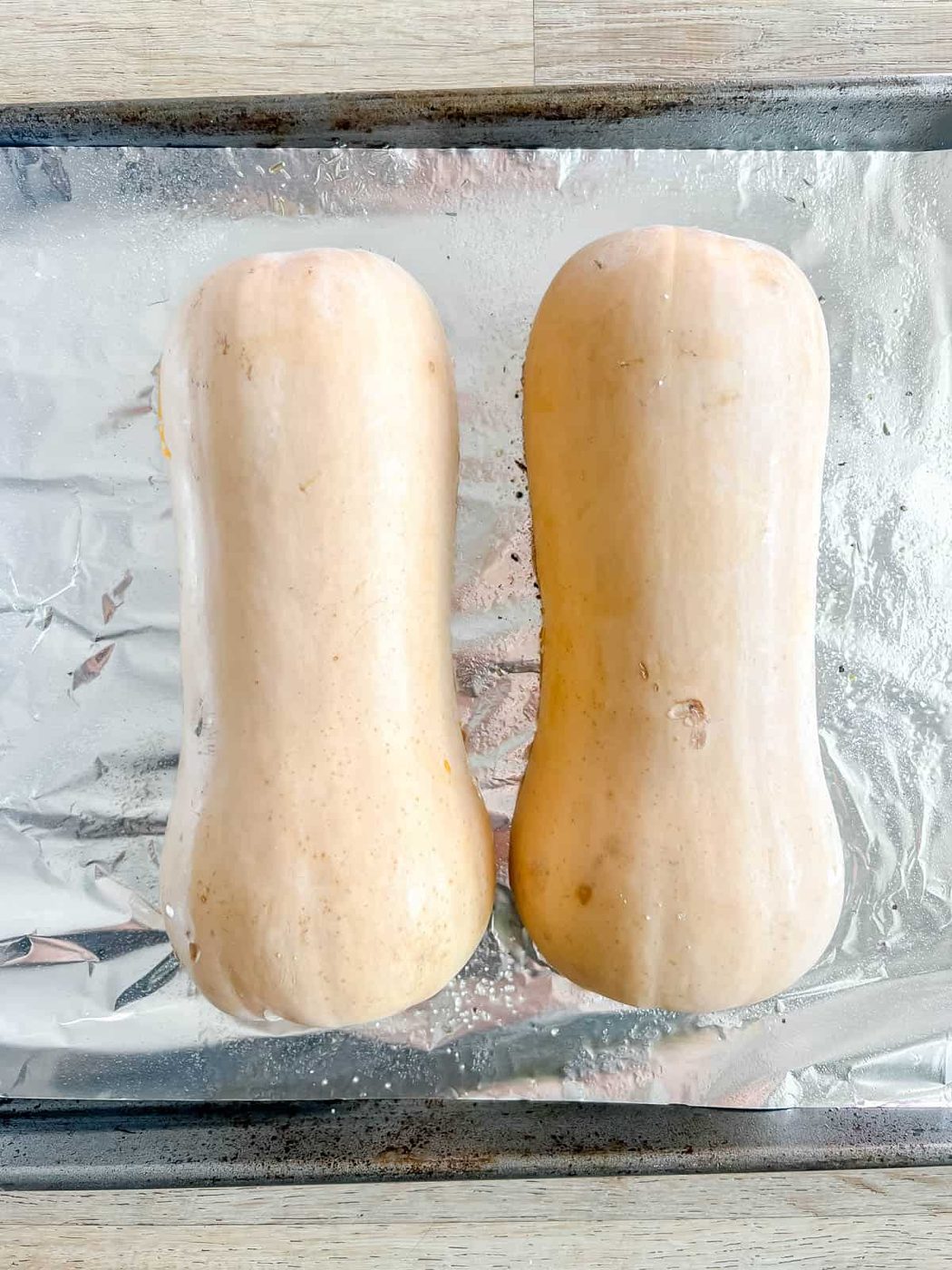 Butternut squash before baking on a pan.