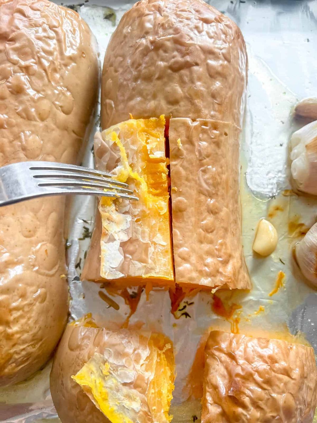 Peeling the skin off butternut squash soup.