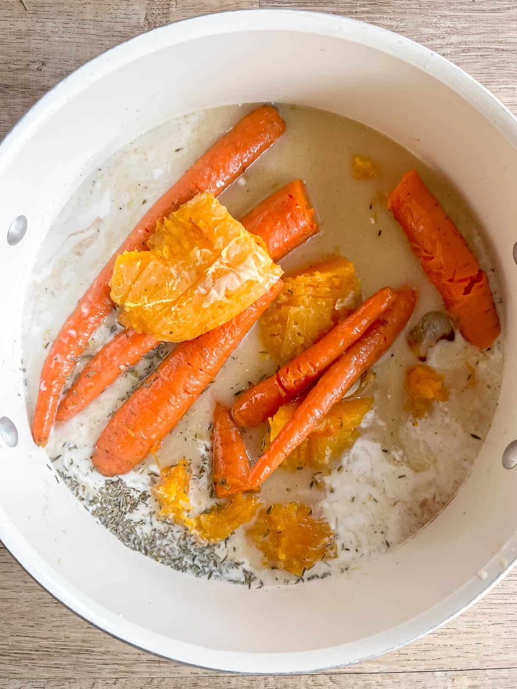 All the soup ingredients in a soup pan.