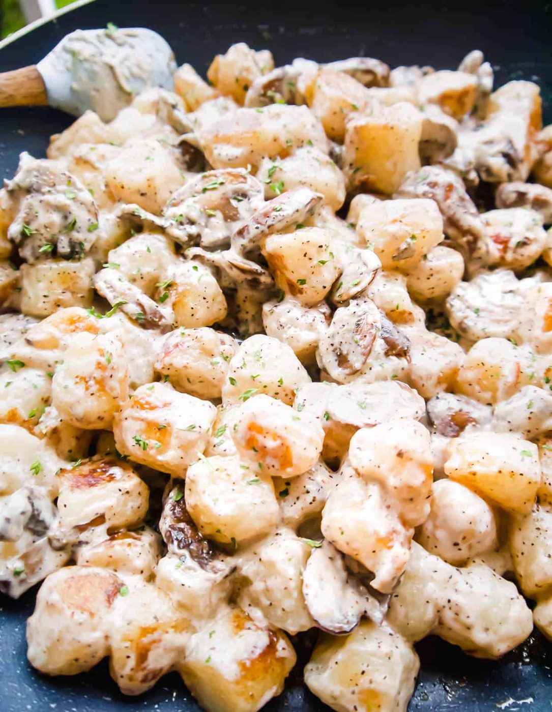 Cooked cauliflower gnocchi added to the mushroom cream sauce.
