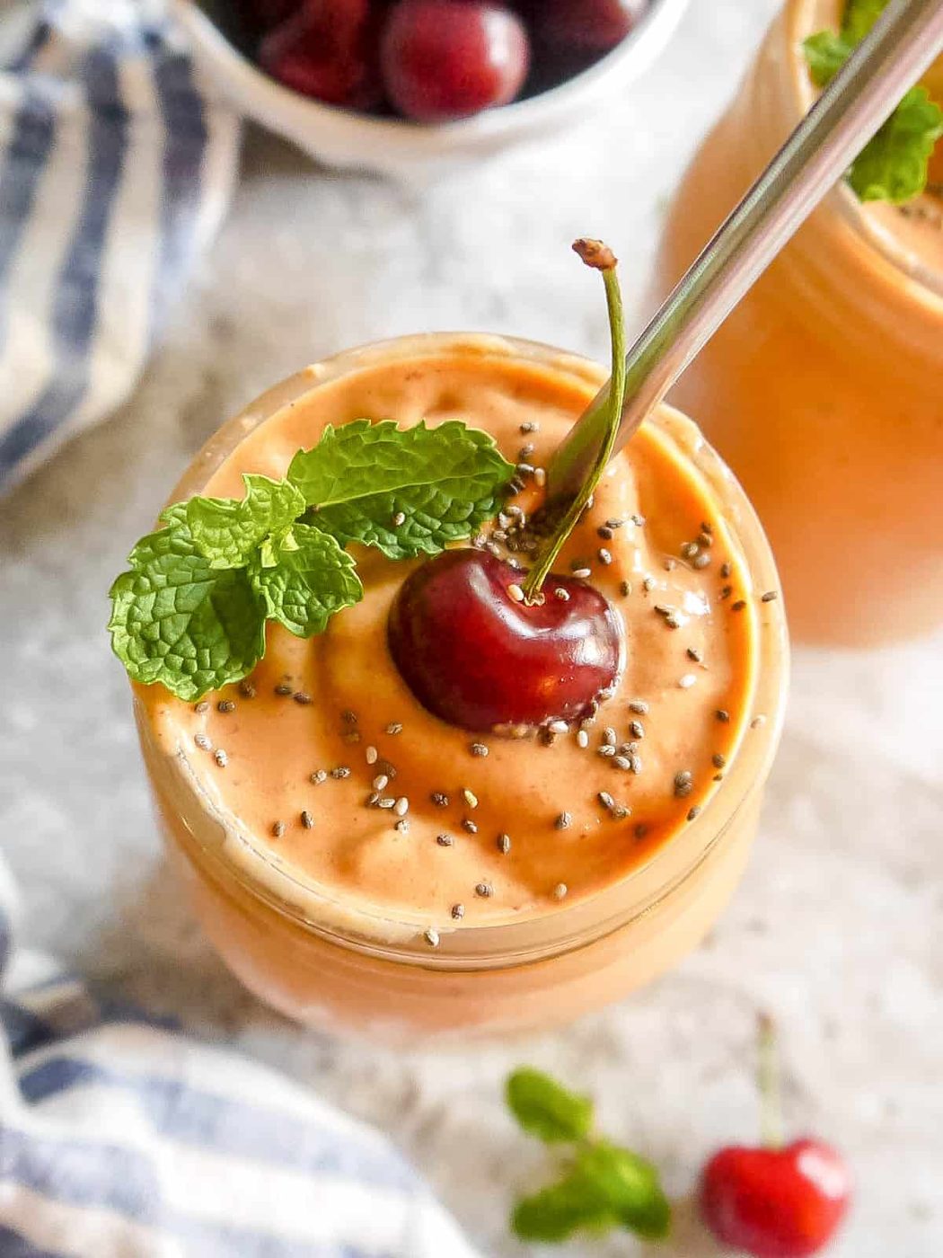 Smoothie with mango and carrot in a large cup.