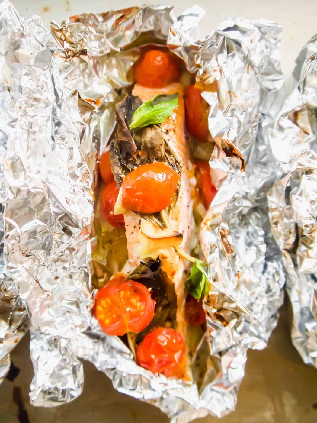Oven baked salmon foil packets .