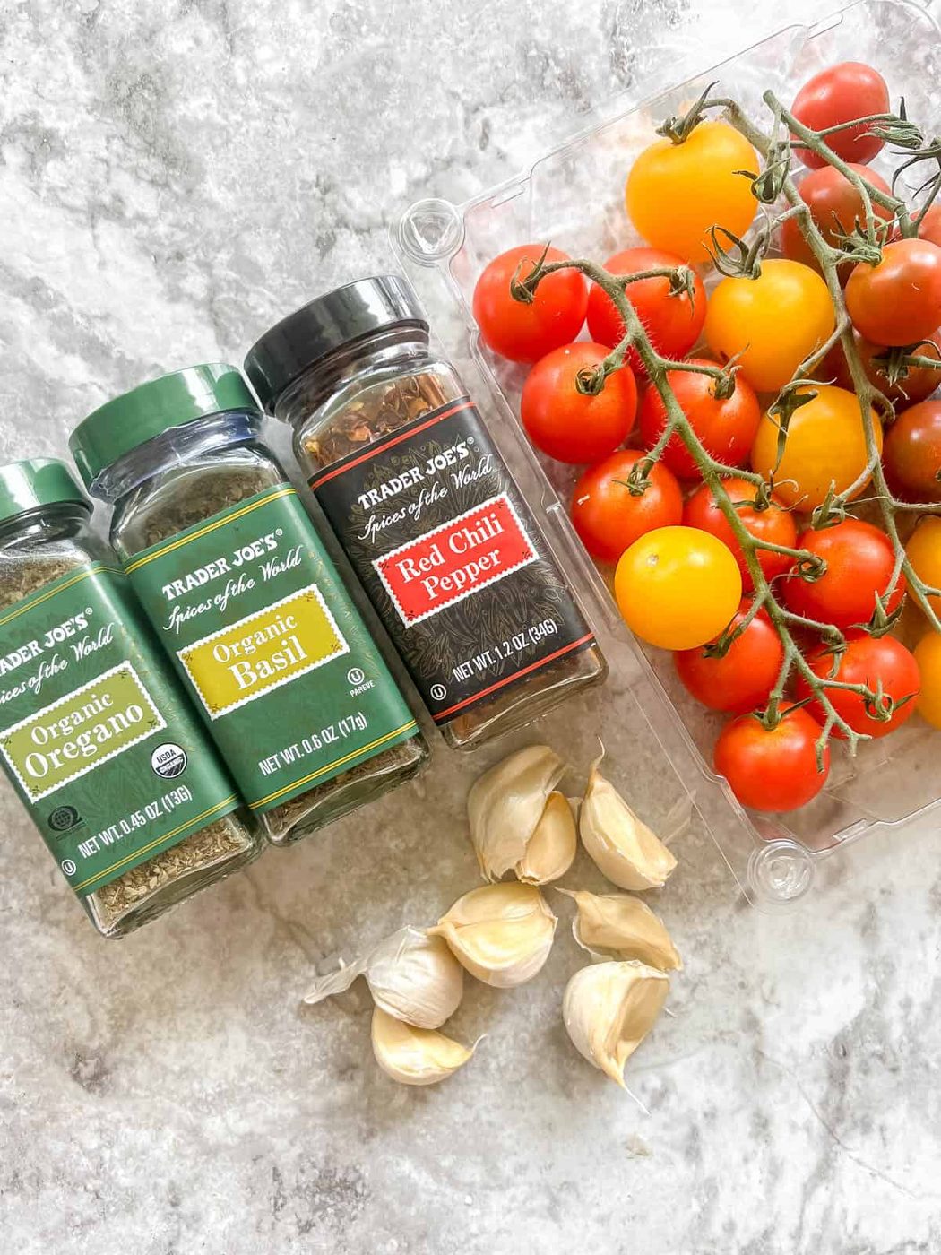 Ingredients needed to make cherry tomato pasta sauce.