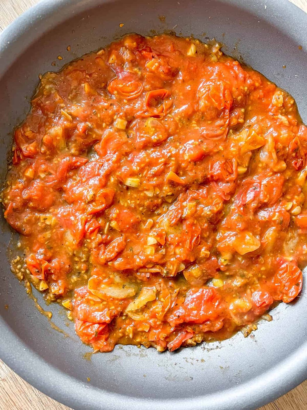 Marinara sauce mixed into the cooked cherry tomatoes.