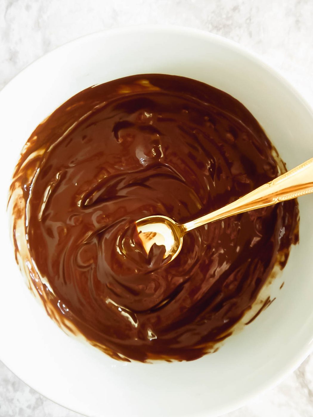 Melted dairy-free chocolate.
