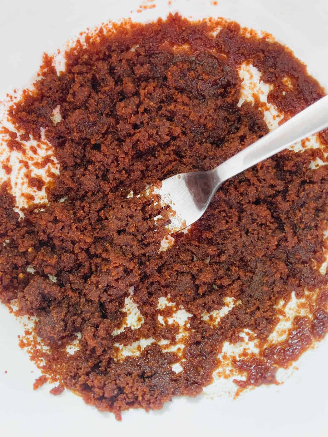 Coconut sugar and olive oil mixed in a bowl.