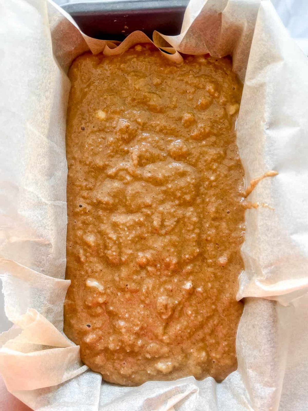 Paleo banana bread batter in a pan.