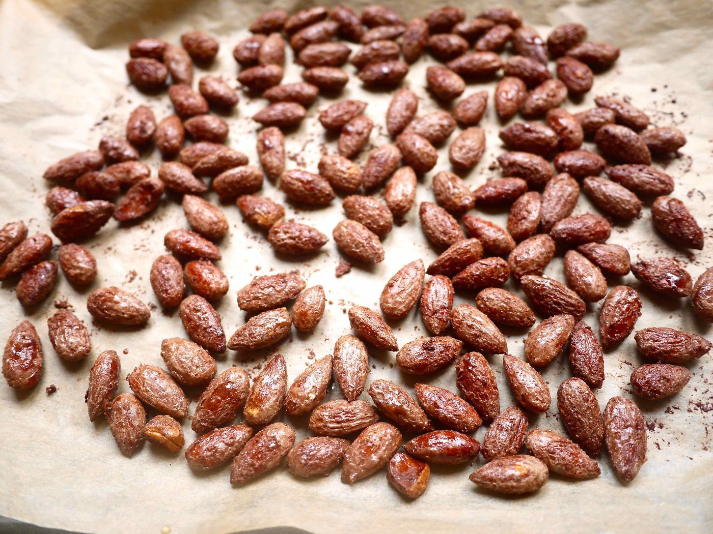 Lighter candied almonds on a pan.
