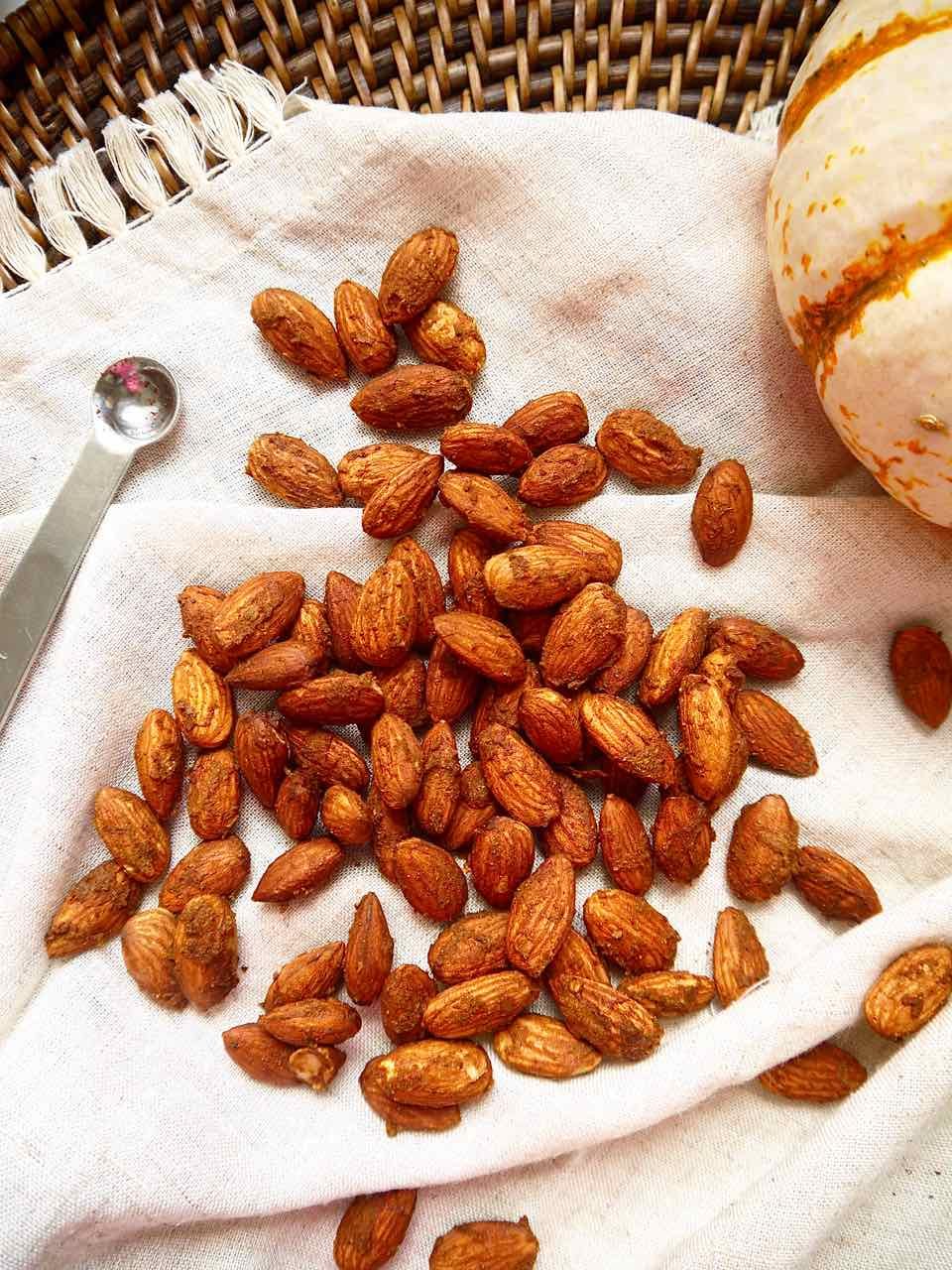 Pumpkin spice roasted almonds on a napkin.