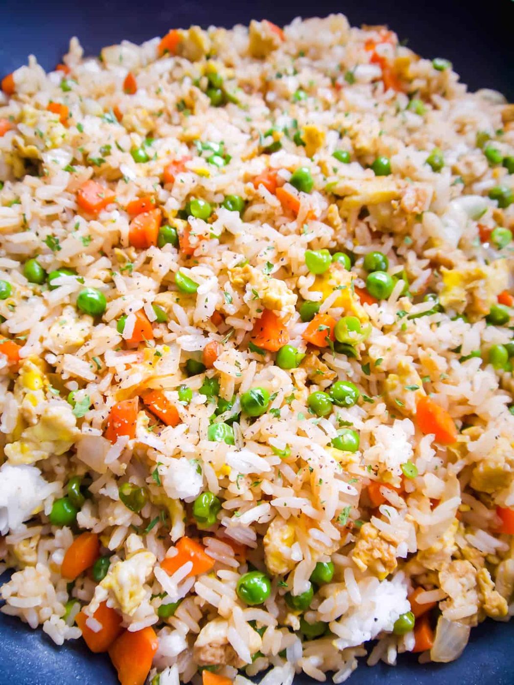 Finished coconut aminos fried rice in a frying pan.