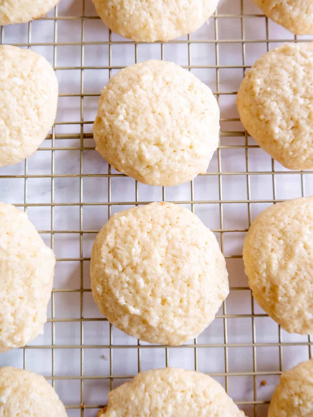 Cottage cheese cookies on a cooling rack.