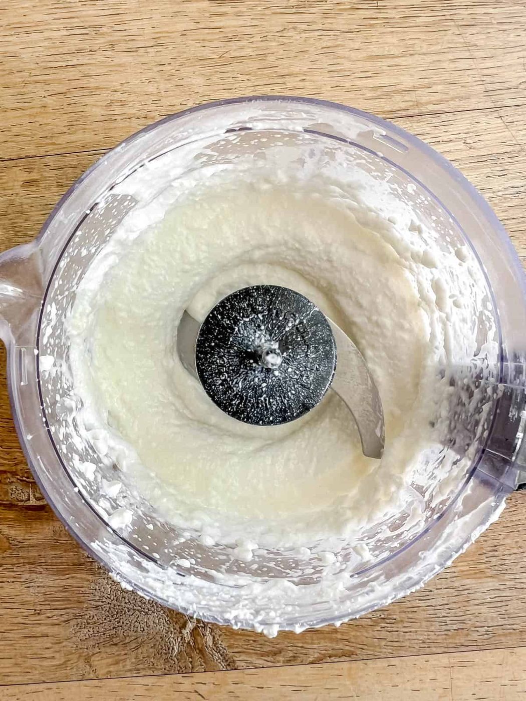 Blended cottage cheese in a food processor.
