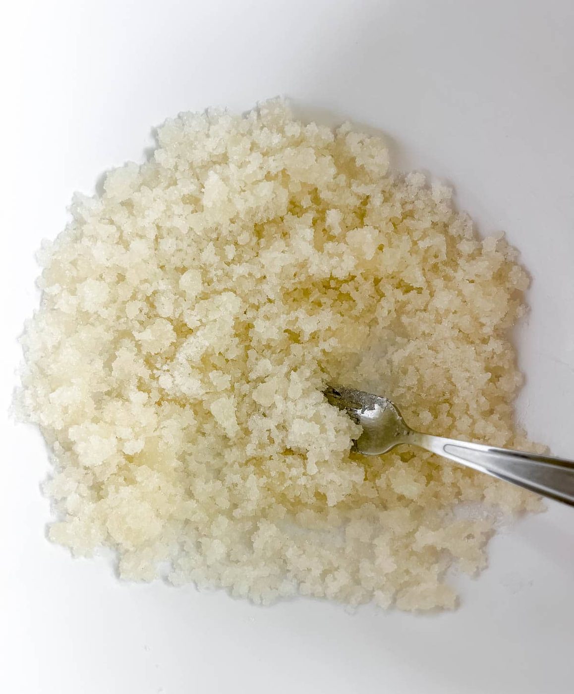 Sugar and olive oil mixed together.
