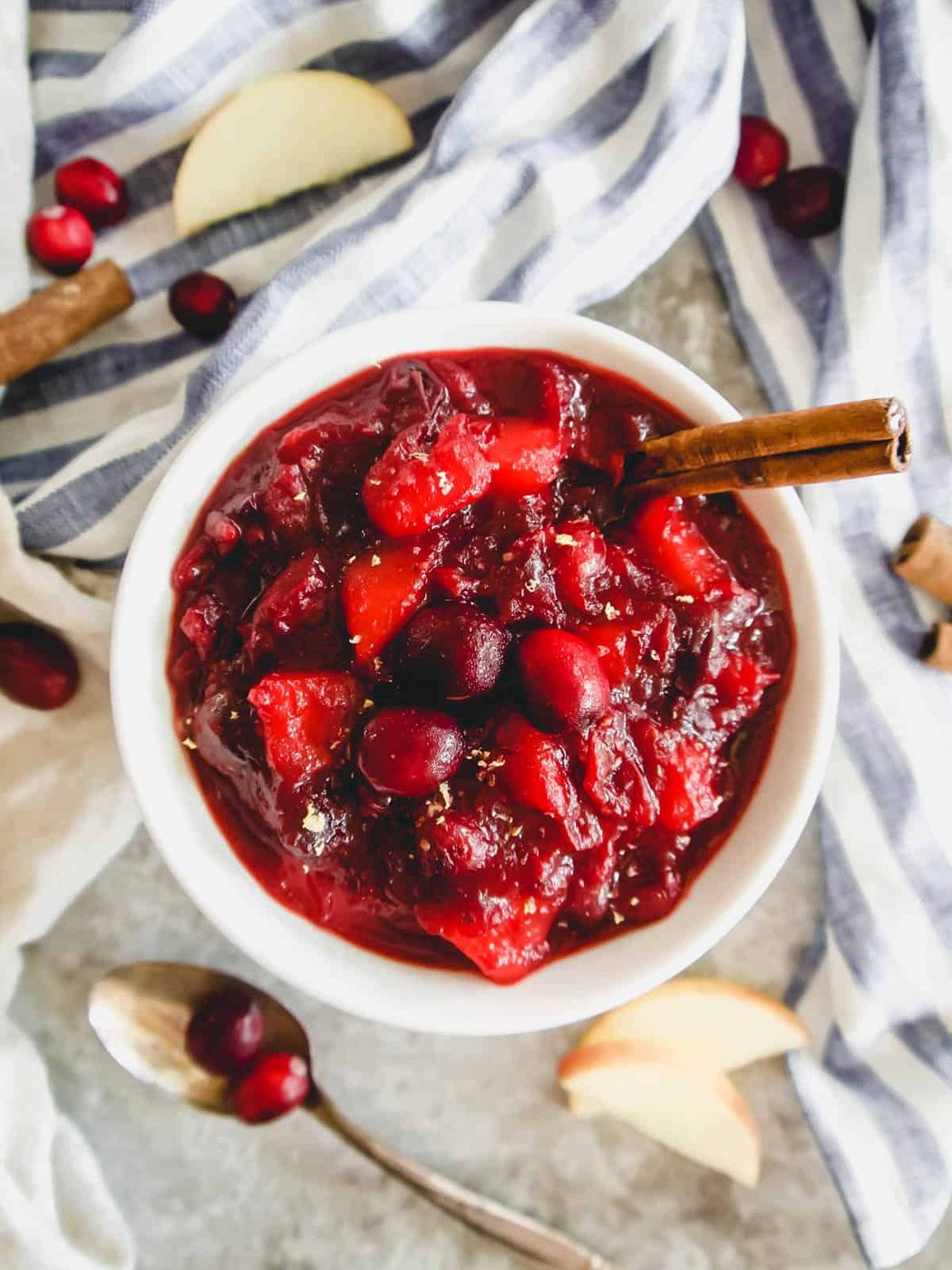 Apple cranberry sauce in a bowl with spices.
