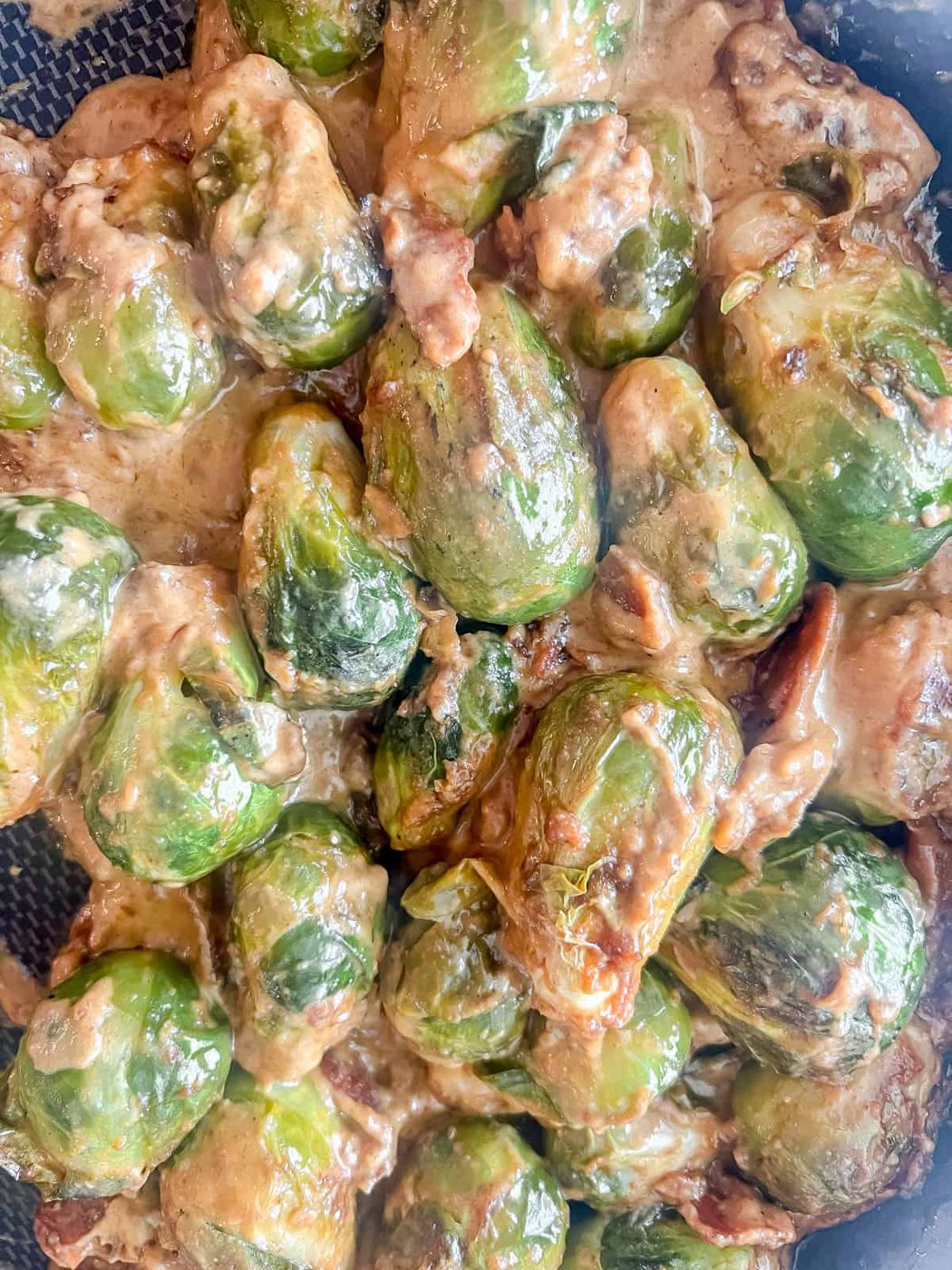 The sauce mixed together with the brussels sprouts.