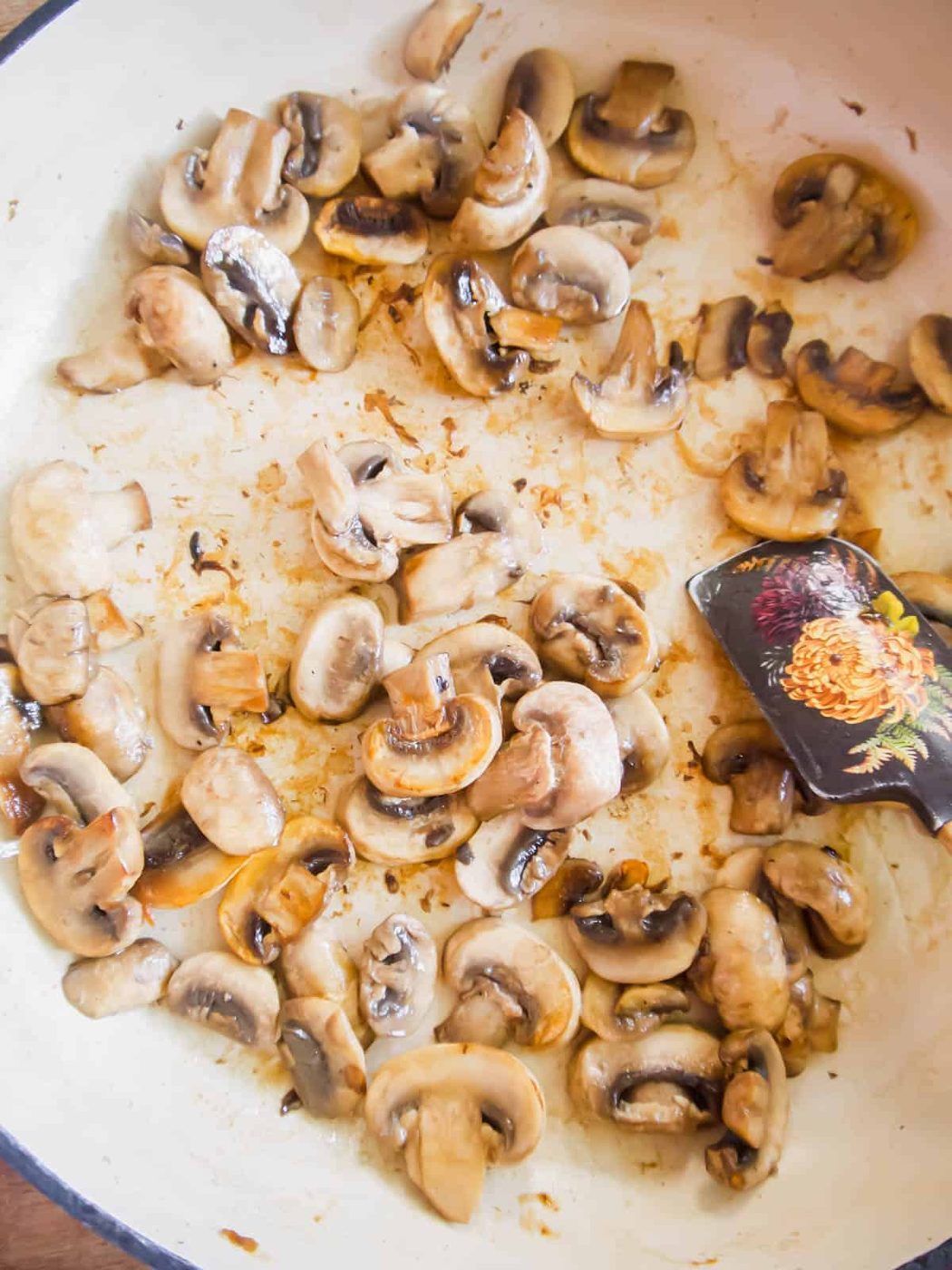 Sauteed mushrooms in a pan.