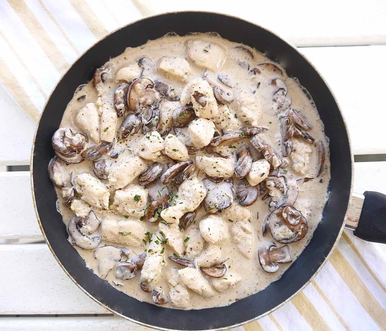 Potato mushroom casserole in a frying pan.