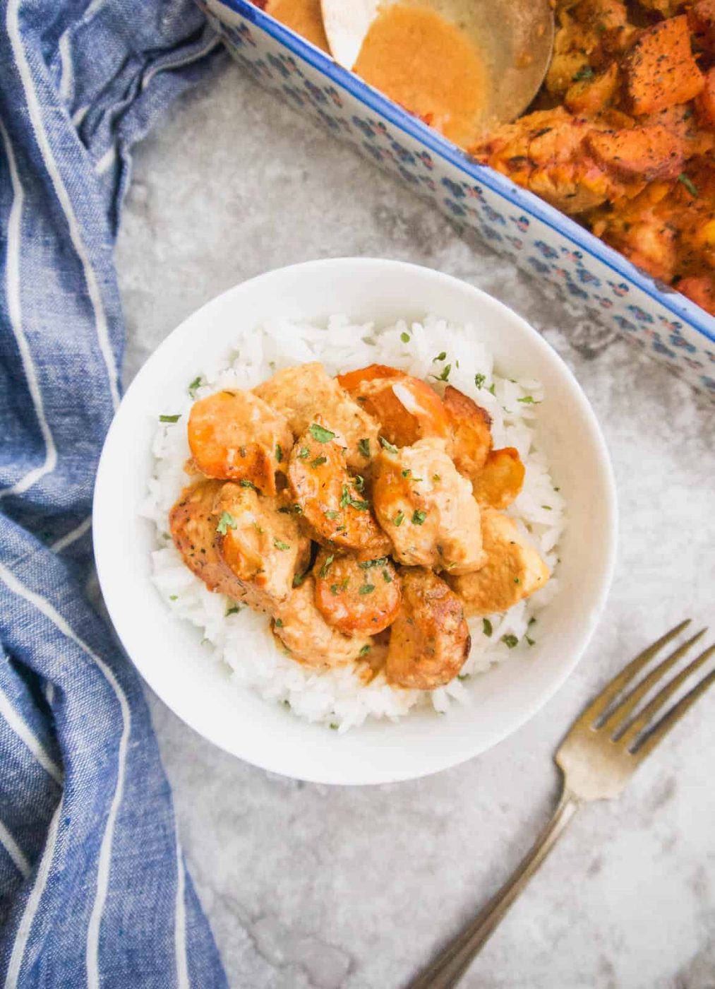 Dairy free gluten free chicken casserole with tomato mustard sauce in a bowl.