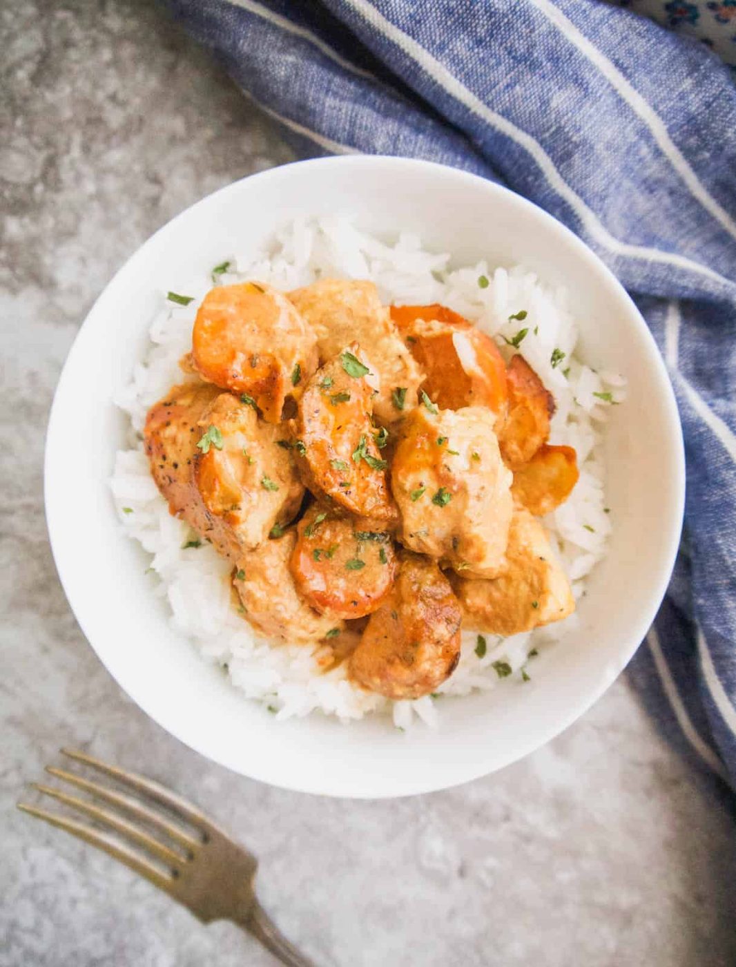 Creamy mustard chicken casserole with tomato in a bowl.