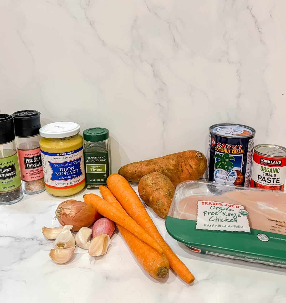 Ingredients needed to make dairy-free chicken casserole with tomato mustard cream sauce.