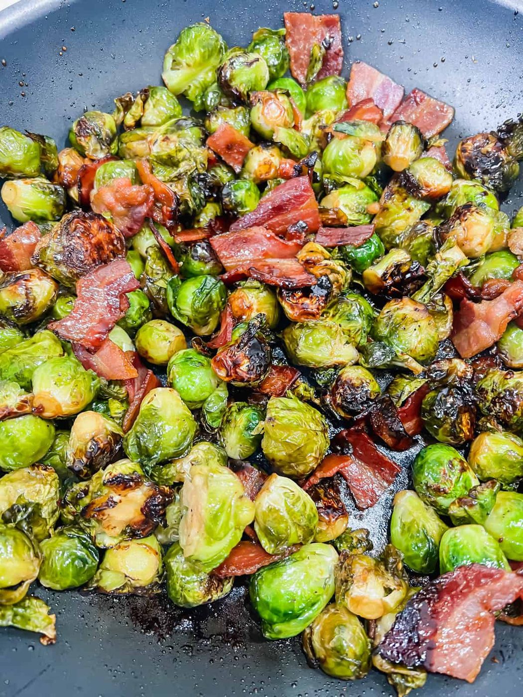 Pan fried brussel sprouts with bacon after cooking.