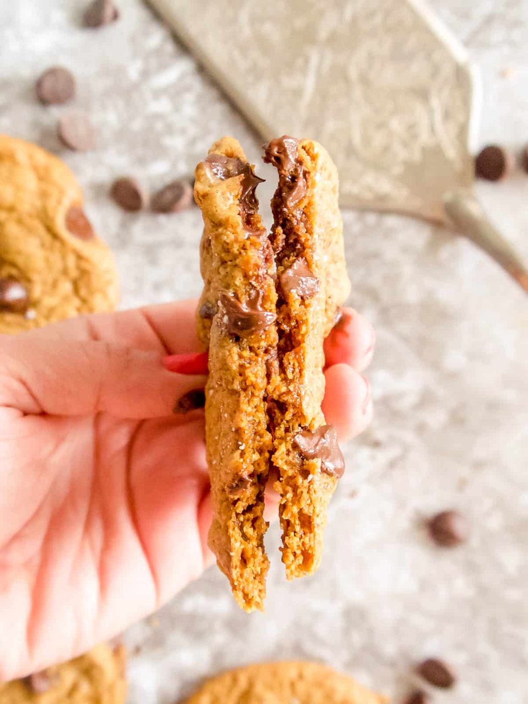 Crispy almond flour chocolate chip cookies cut in half.