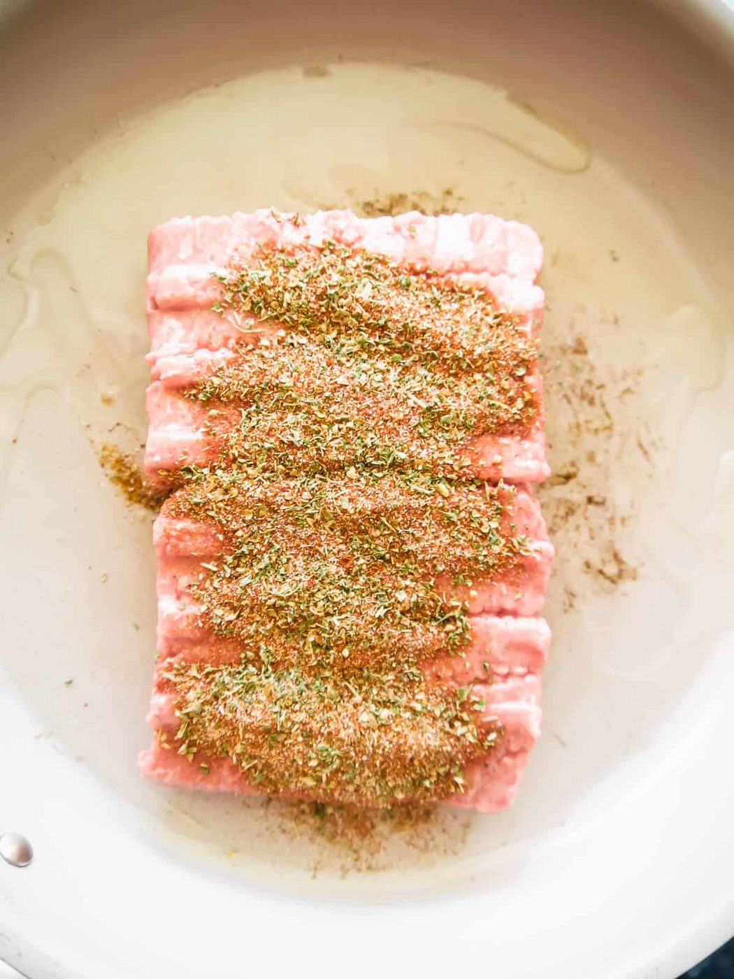 Ground turkey in a pan with spices.