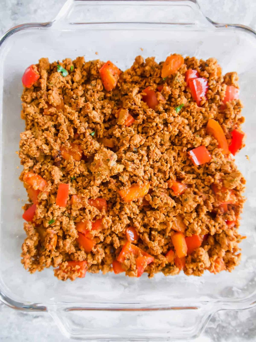 Ground turkey layer in a baking dish.
