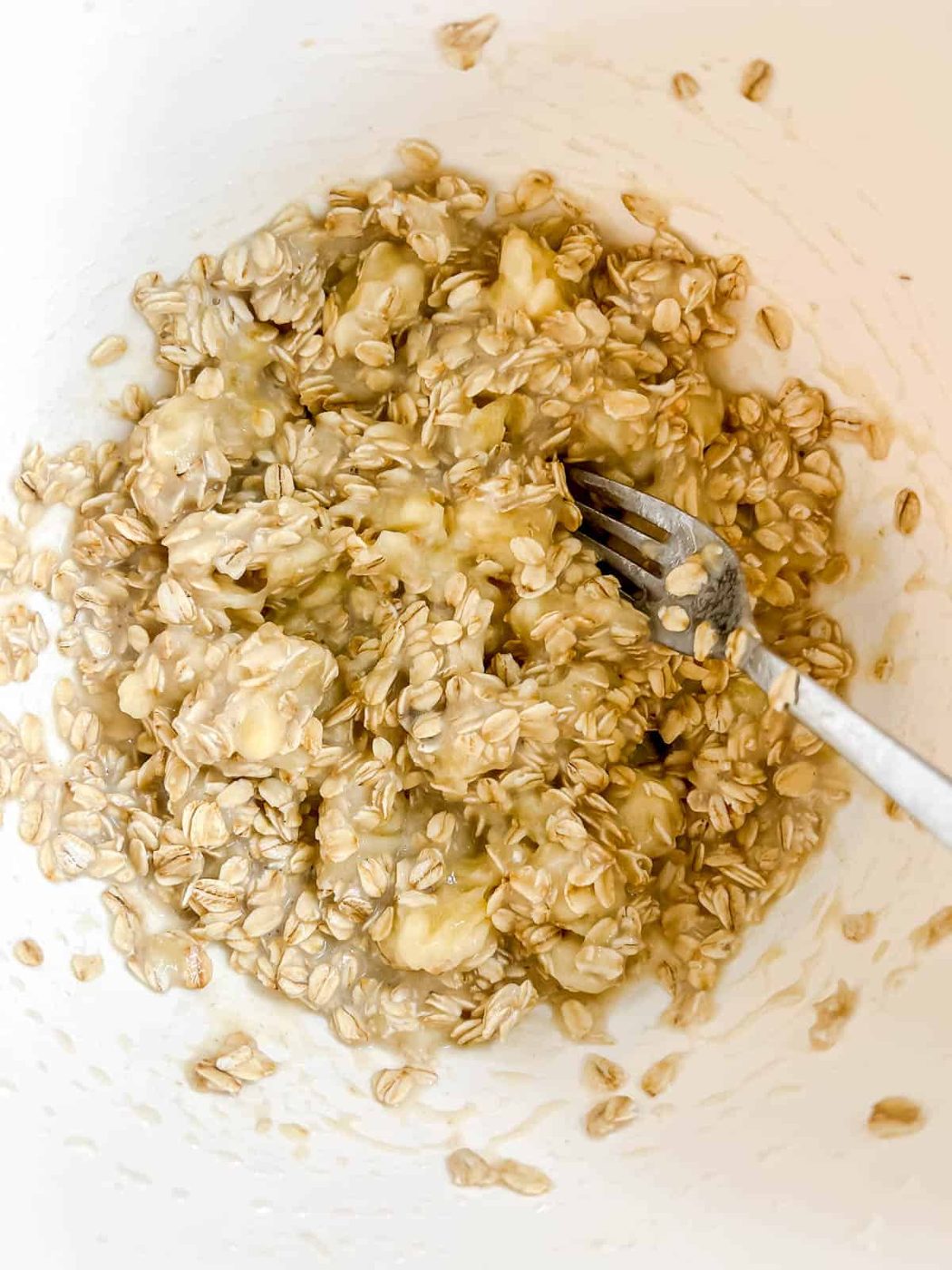 Oats mixed into banana and milk.