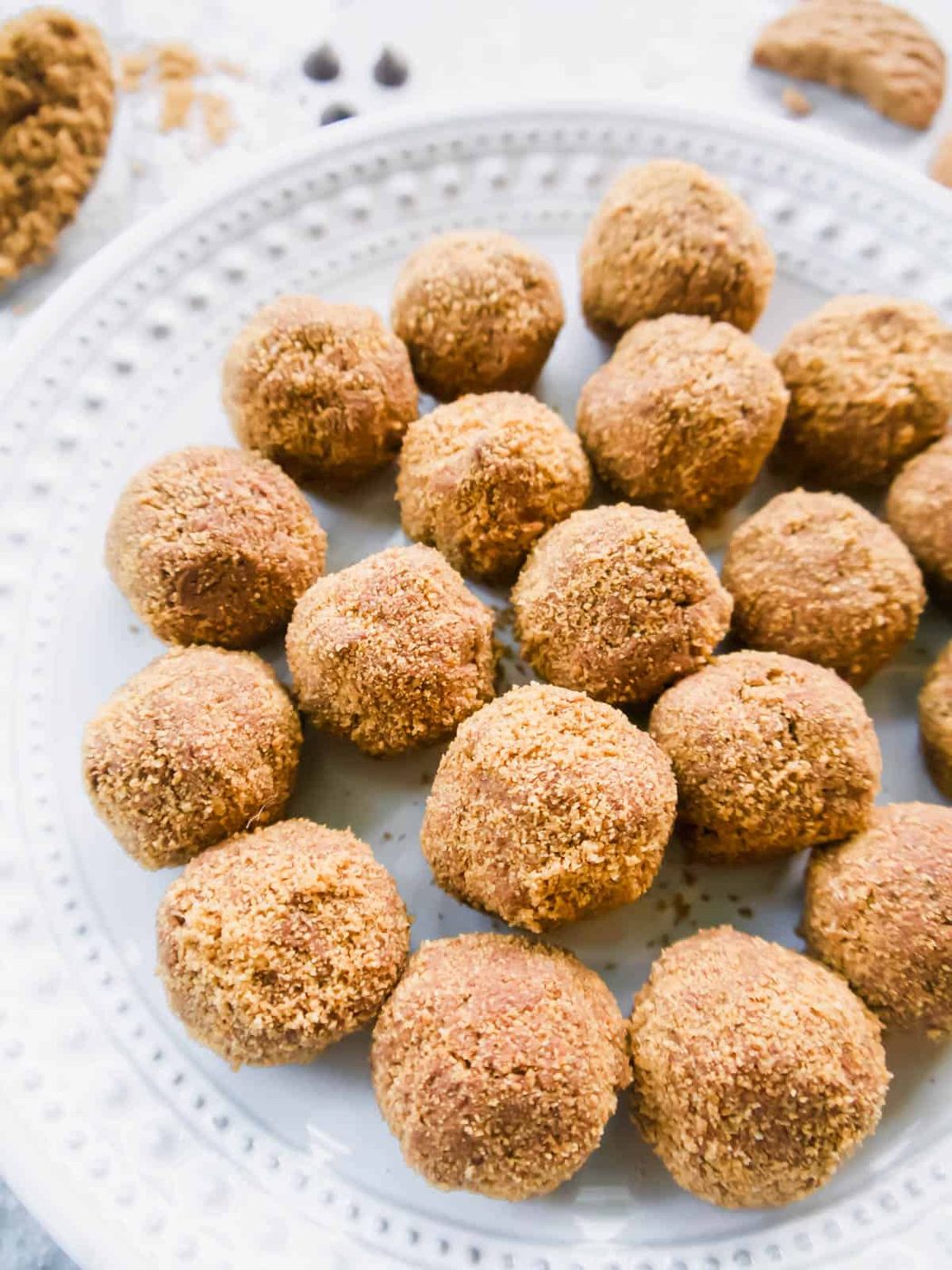 Side angle of chocolate mousse balls on a plate.