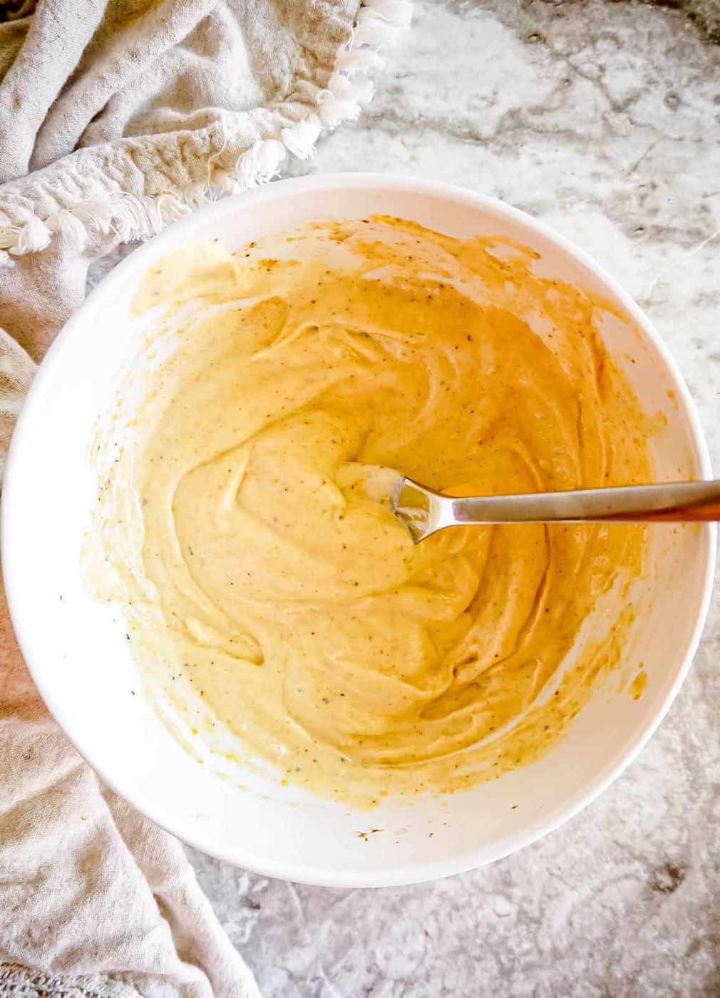 The lime mayo sauce in a bowl.