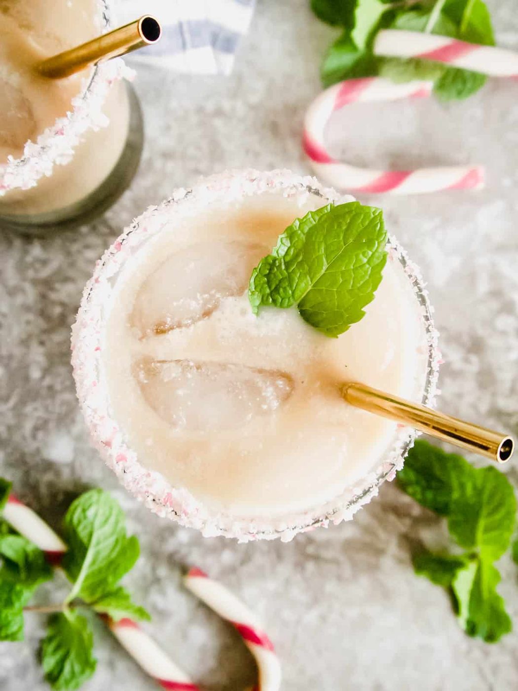 Peppermint white russian cocktail with a candy cane rim.