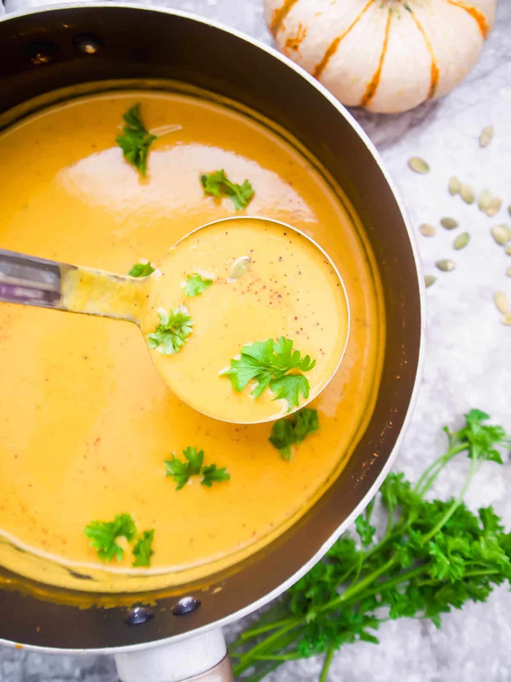 Sweet potato pumpkin soup being served.